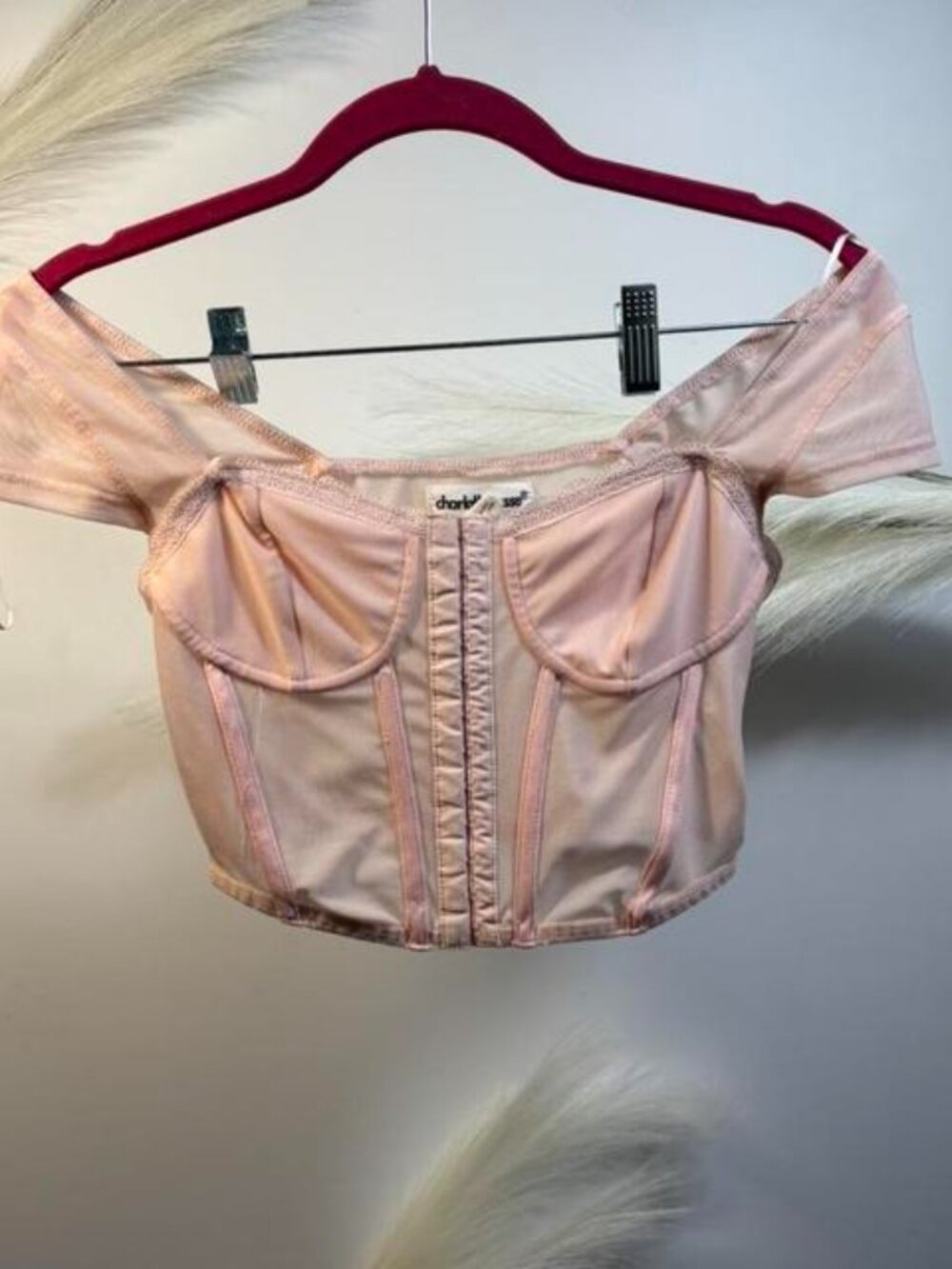 Pink corset top with lace details and zipper back. Size: S
